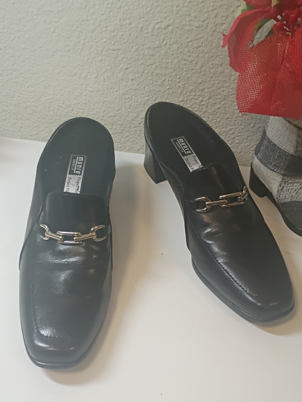 Munro Black Leather Slip-On Mules with Gold Chain Accent